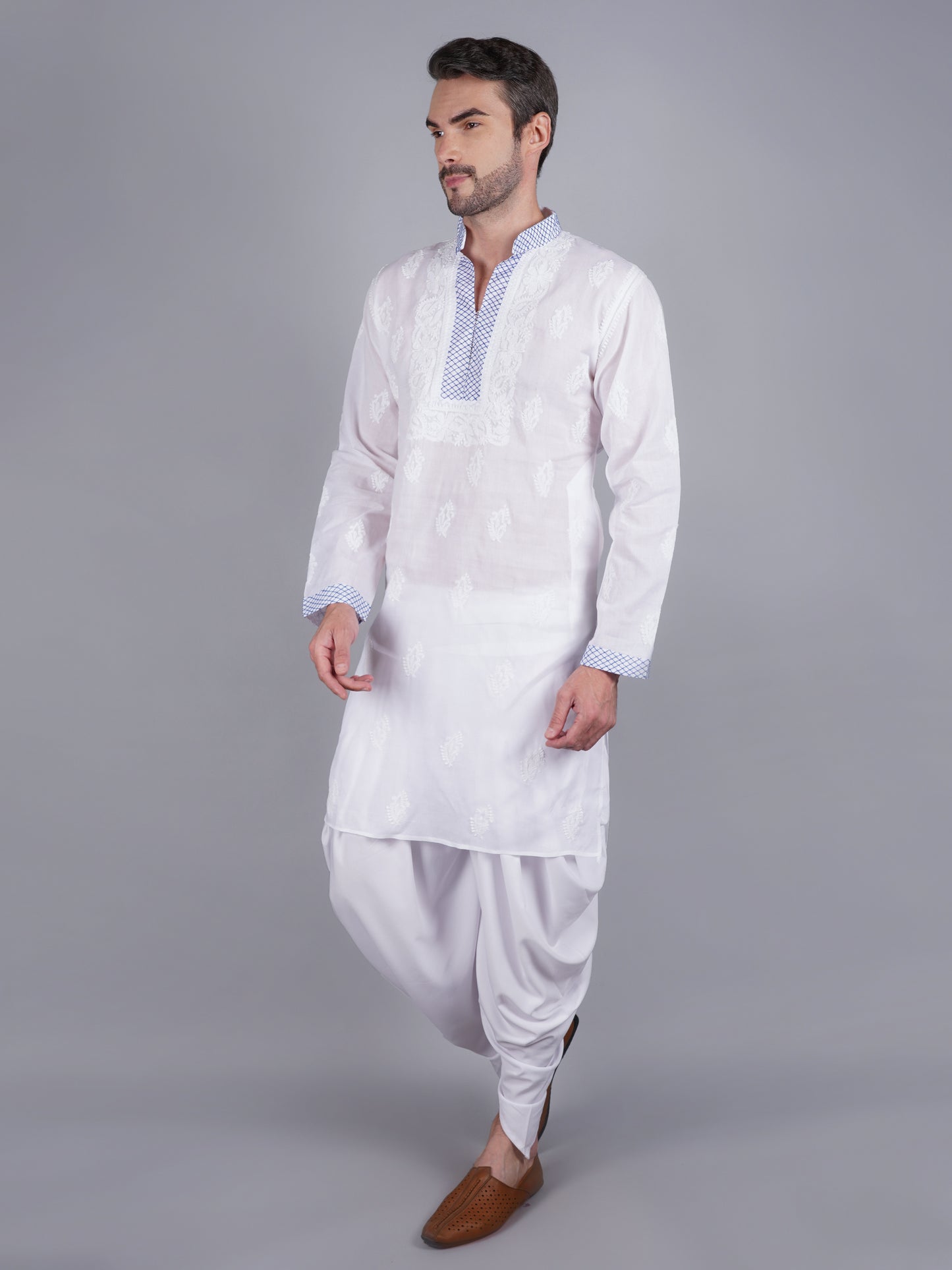 Men White chikankari Kurta  made of pure white Linen, full length, button closure, blue thread work on placket, full sleeves, mandarin collar, side pockets, traditional wear for family occasions, casual wear