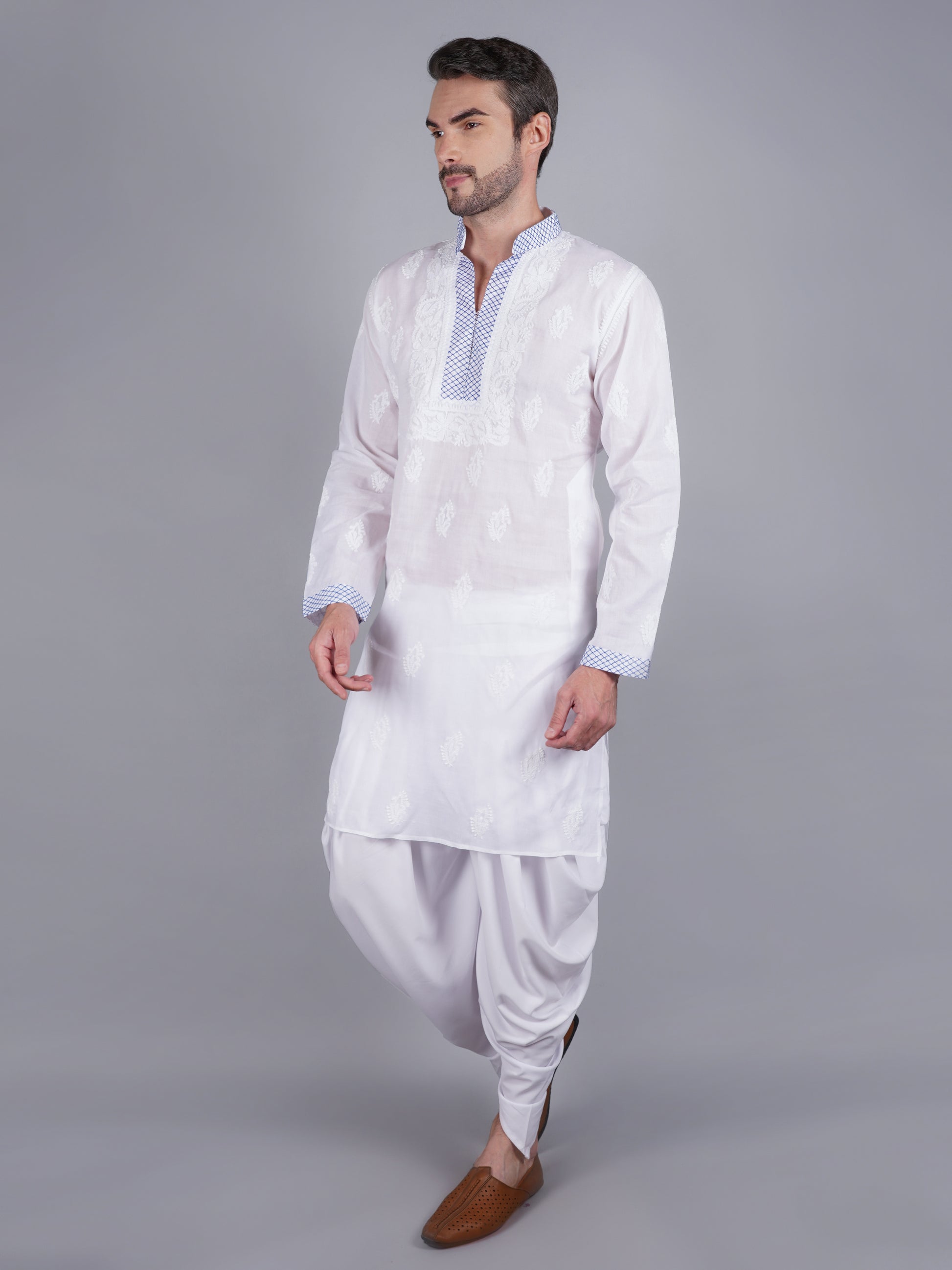 Men White chikankari Kurta  made of pure white Linen, full length, button closure, blue thread work on placket, full sleeves, mandarin collar, side pockets, traditional wear for family occasions, casual wear