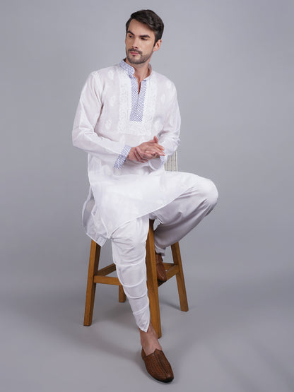 Men White chikankari Kurta  made of pure white Linen, full length, button closure, blue thread work on placket, full sleeves, mandarin collar, side pockets, traditional wear for family occasions, casual wear