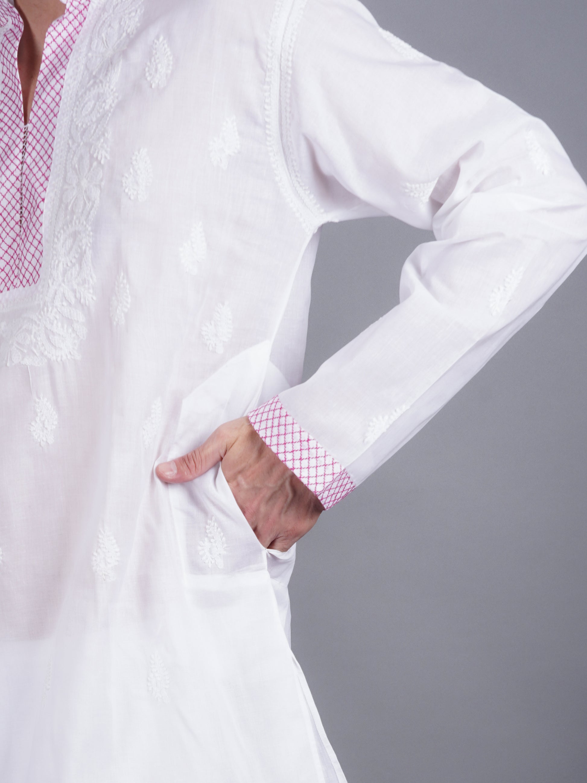 Men White chikankari Kurta  made of pure white Linen, full length, button closure, pink thread work on placket, full sleeves, mandarin collar, side pockets, traditional wear for family occasions, casual wear
