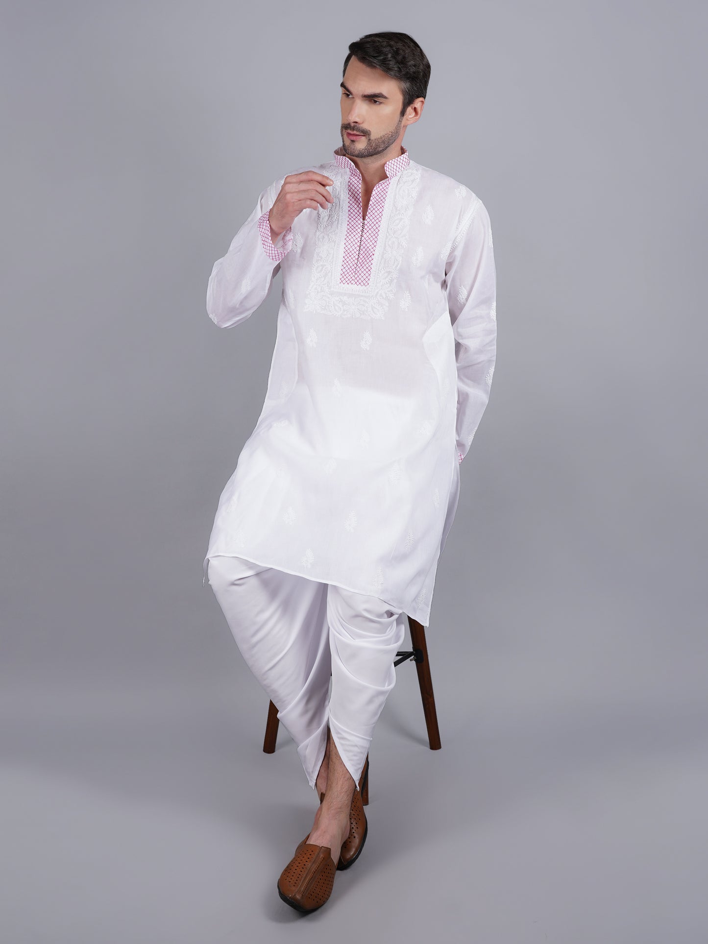 Men White chikankari Kurta  made of pure white Linen, full length, button closure, pink thread work on placket, full sleeves, mandarin collar, side pockets, traditional wear for family occasions, casual wear