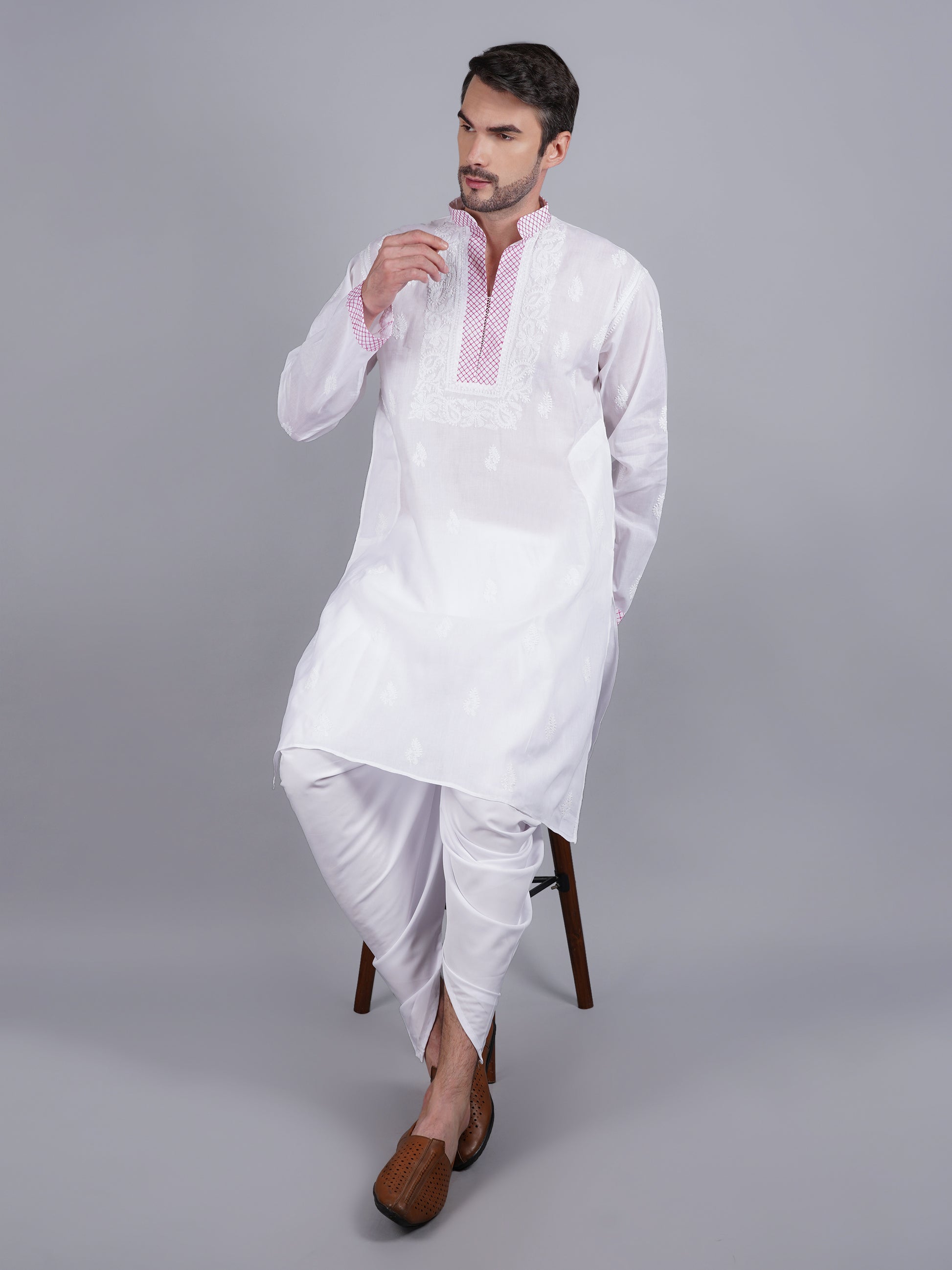 Men White chikankari Kurta  made of pure white Linen, full length, button closure, pink thread work on placket, full sleeves, mandarin collar, side pockets, traditional wear for family occasions, casual wear